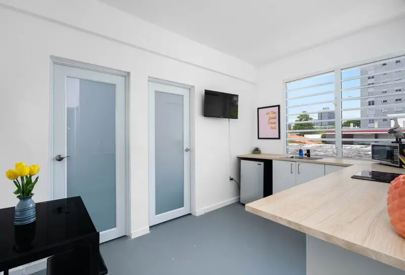 Kitchenette & dining area with city views