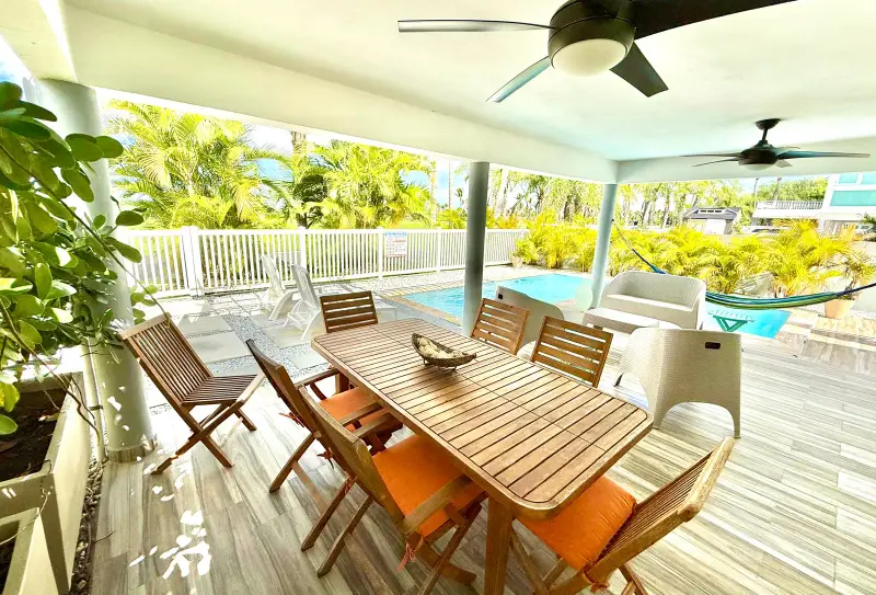 Private Pool | Steps to Beach | Gated Golf Resort 2 Covered terrace with outdoor dining steps from the private pool