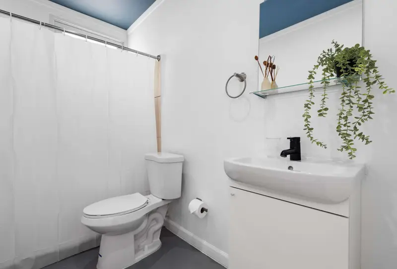 Clean full bathroom with shower & modern vanity
