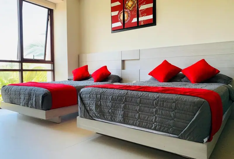 Bedroom 1: two double beds and en-suite bathroom
