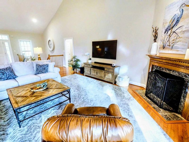 Experience luxury and comfort in this spacious lakefront home, featuring an open-concept design, vaulted ceilings, and stunning natural light.