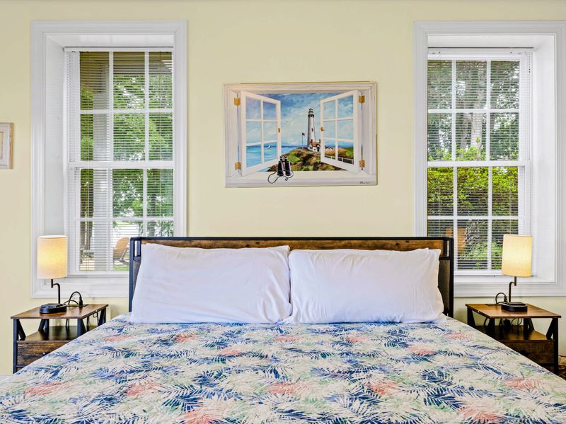 Bright, lake-themed, and comfortable, with a king bed and backyard access.