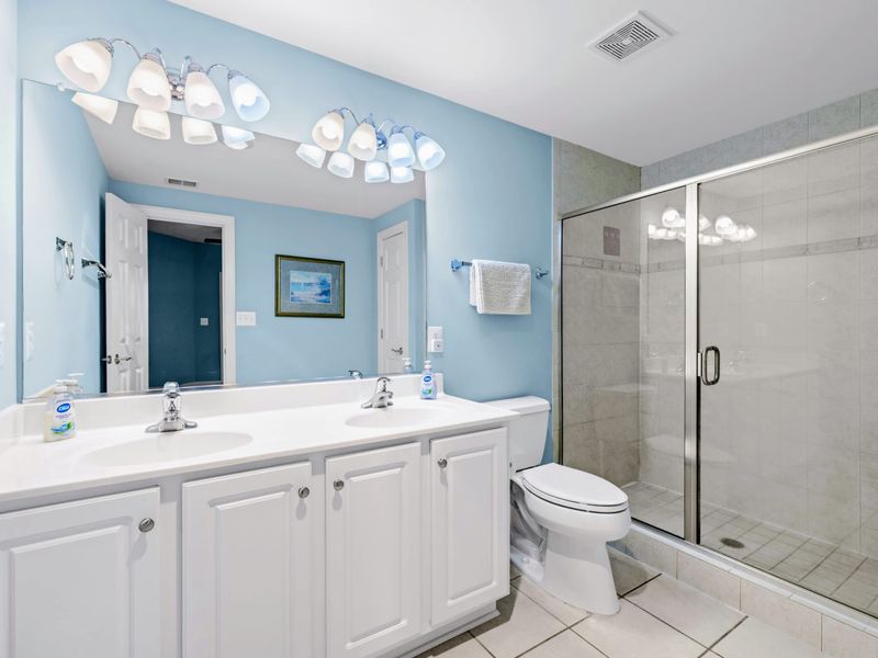 Suite 3's private ensuite bath, spacious and well-stocked.