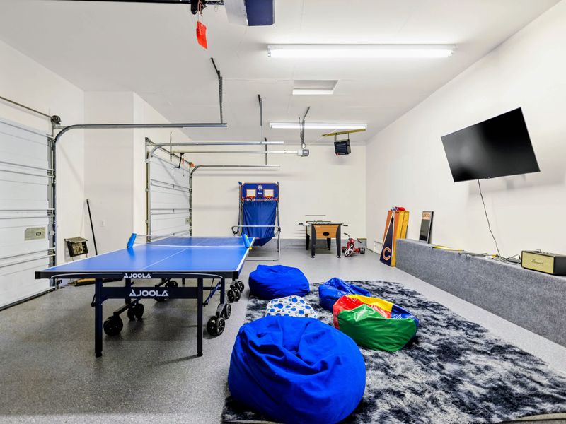 The garage doubles as a rec zone with ping pong and games for rainy afternoons.