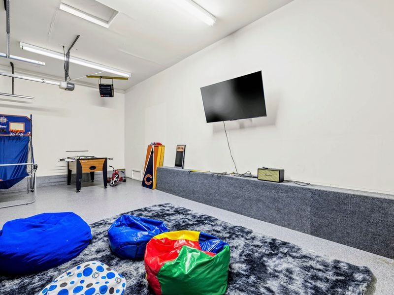 Bean bags, games, and room to play in the converted garage.