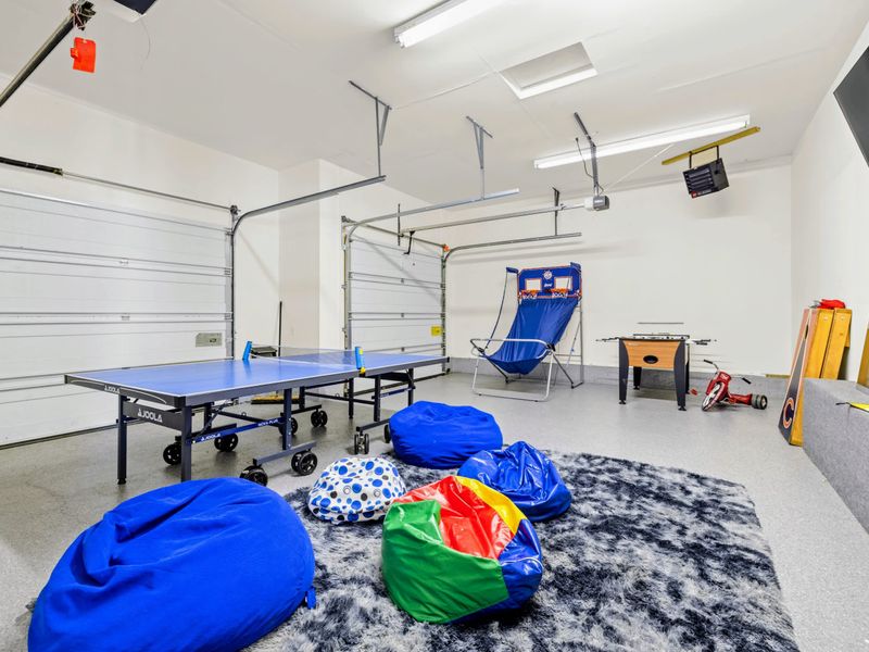 Ping pong and arcade basketball make the garage a kid magnet.