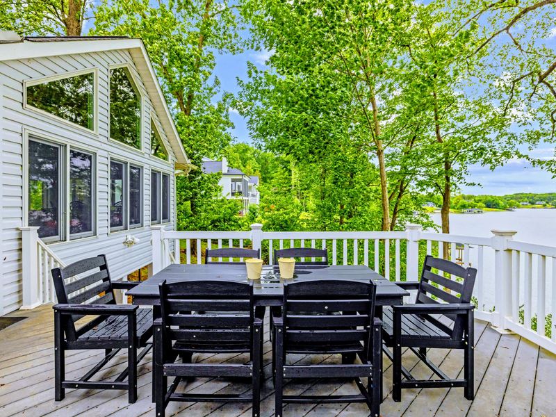 Adirondack chairs and open water, the deck is built for slow lake evenings.