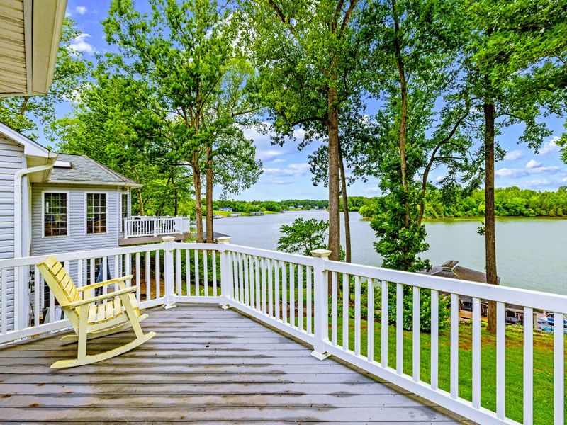 Step from the primary suite onto a private deck and take in the sunrise over the cove.