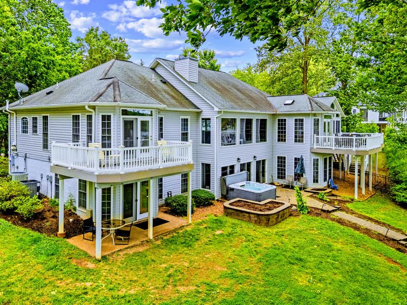 Mature trees and an open lawn make the backyard a private retreat.