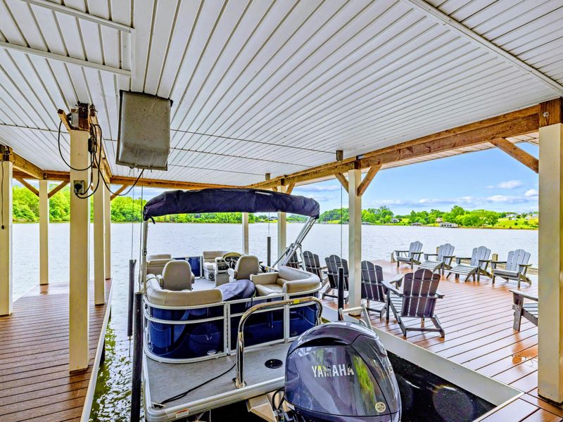 Boat slips and a sun deck make the dock the center of lake life.