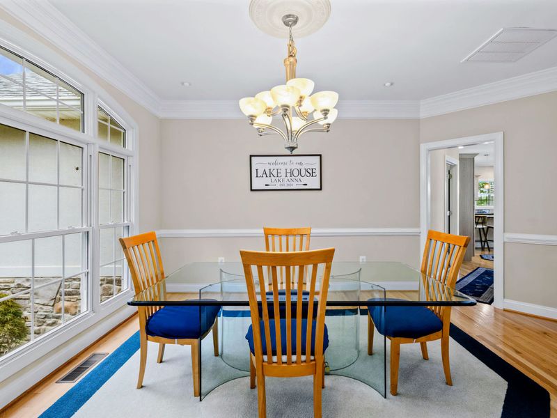 Gather around the table for family meals, framed by natural light.
