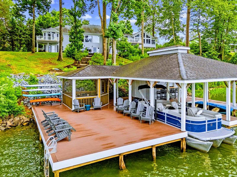 The dock reaches into the cove for deep-water access and big views.