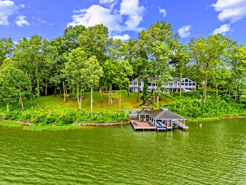 Aerial look at the wooded shoreline and the home's commanding lake frontage.