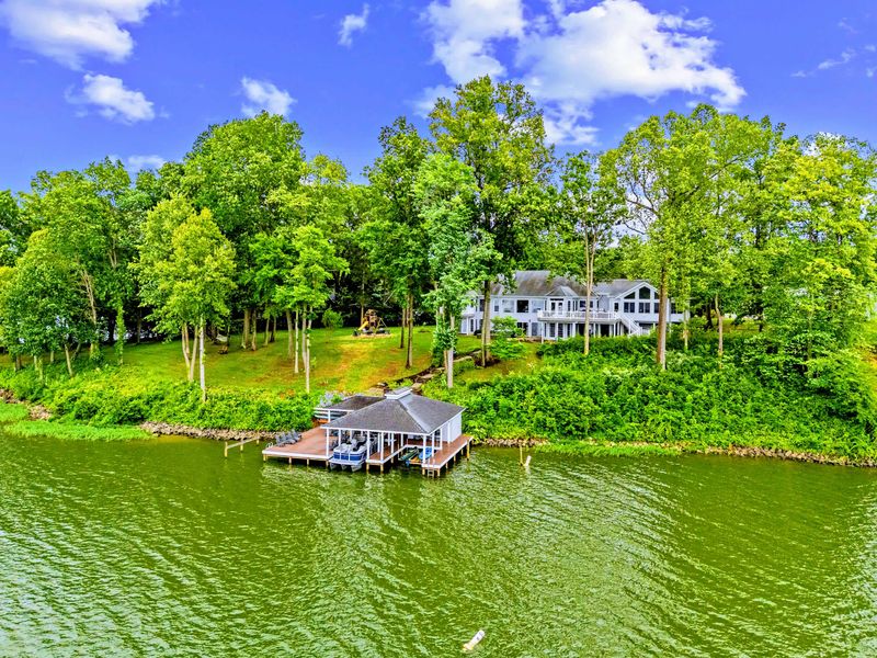 Drone view across the cove, showing the calm, protected water just off the dock.