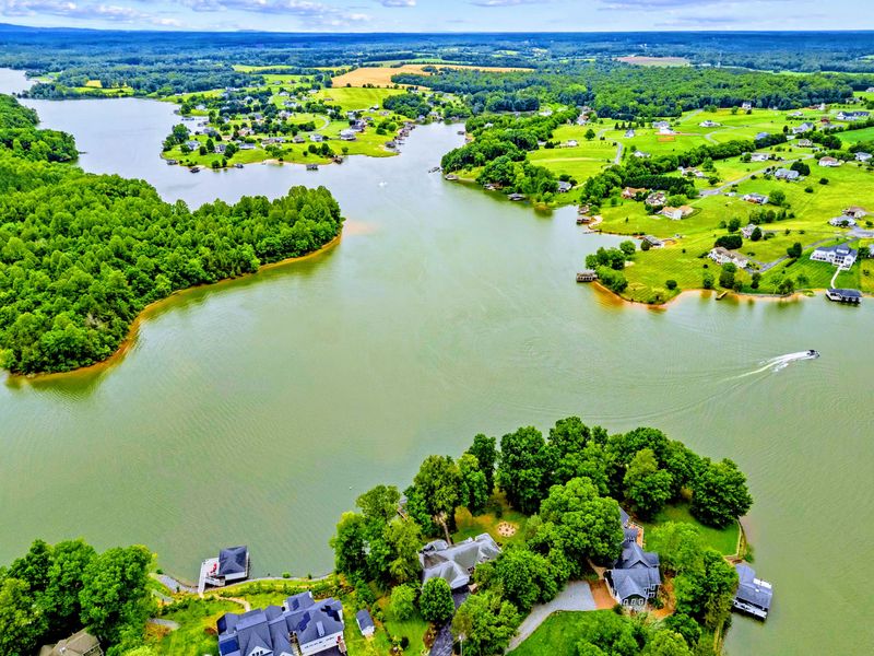 Sweeping overhead view of the dock, shoreline, and surrounding coves.