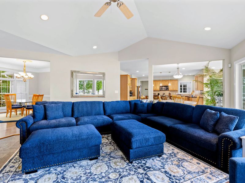 Open-concept living flows from the great room toward the kitchen and out to the water.