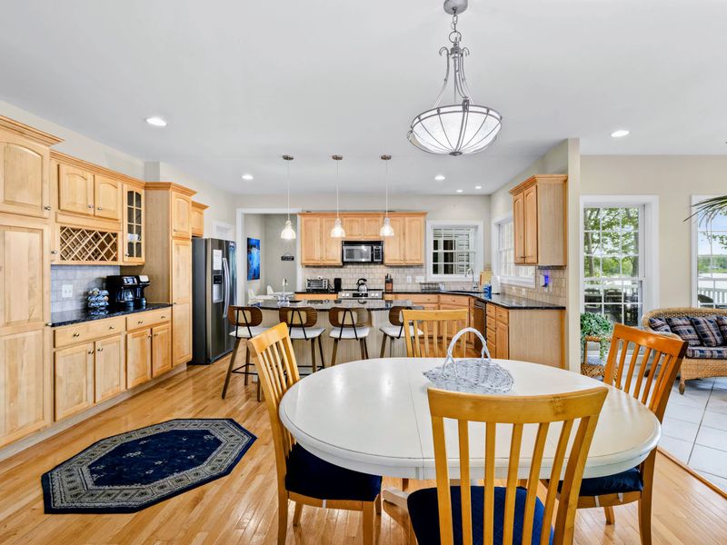 Extra table seating near the kitchen keeps everyone close while meals come together.