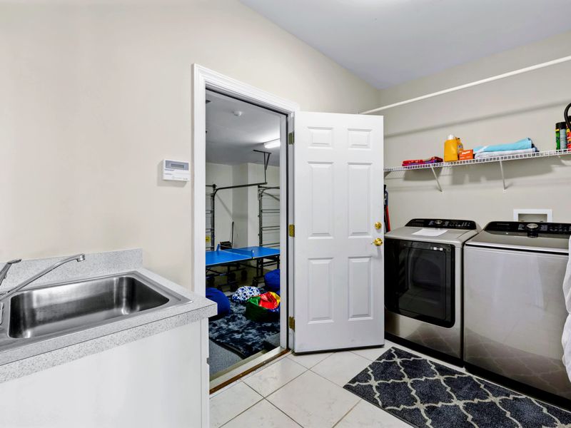 The laundry room keeps beach towels and swimsuits ready for the next lake day.