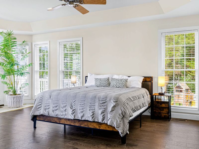 Wake to the water in the king-bedded primary suite.