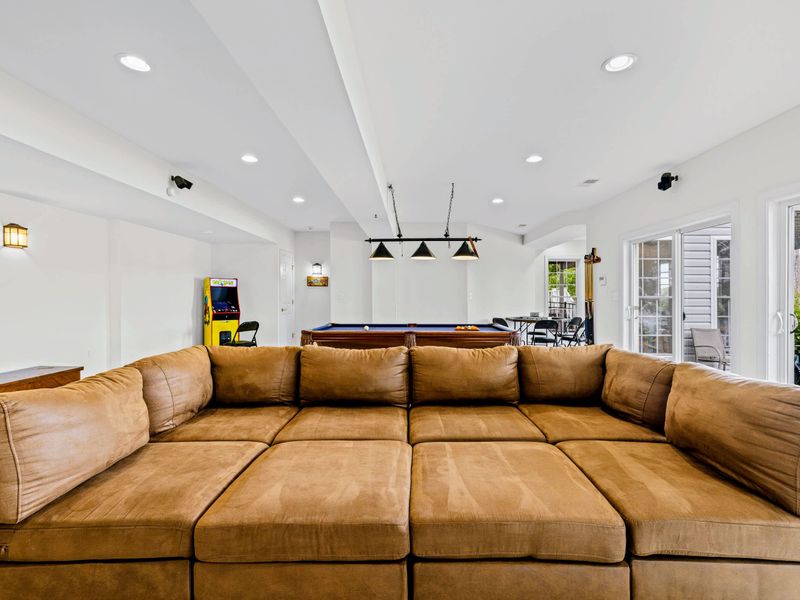 Room to spread out downstairs with a comfortable sectional and walls of light.