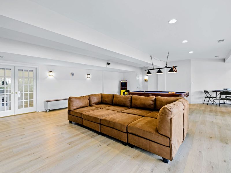 The lower level flows from lounge to games to the outdoors.