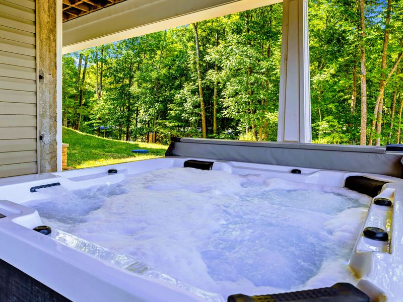 Hot Tub - Sink in and unwind with the backyard and trees framing the view, private and shaded under the deck.