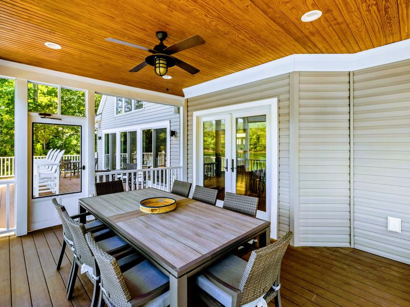 Screened Porch - Bug-free lakeside dining with windows all around bringing in the water and the light.