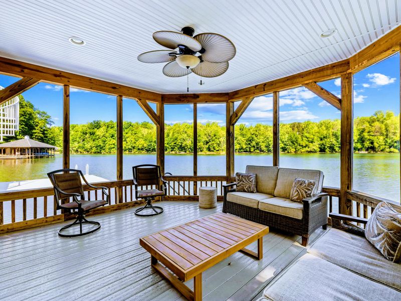 Boathouse Screened Porch - Wicker sofas, a paddle-blade ceiling fan, and water on three sides make this the coolest seat on the lake.