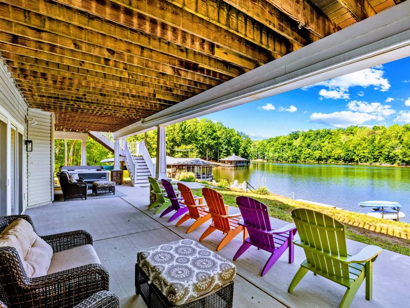 Covered Patio - Comfortable lounge seating and playful color set against calm blue water.