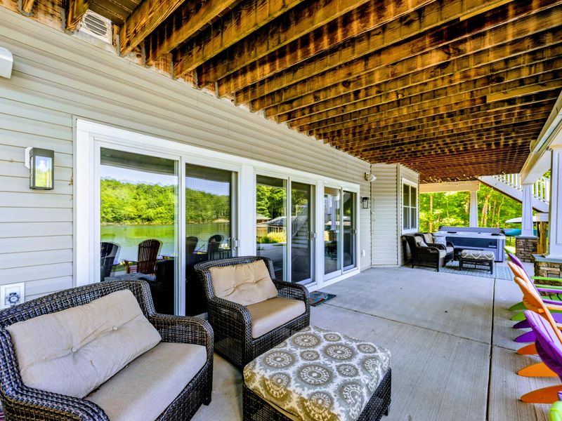 Covered Patio - Sink into the sofas or pull up a colorful Adirondack, all of it shaded and steps from the lawn.