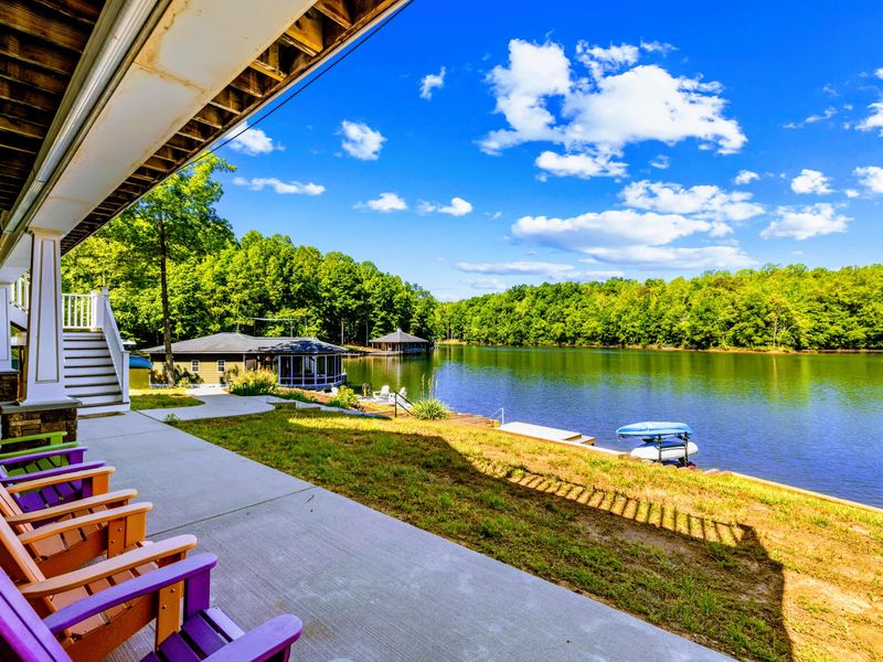 Covered Patio - Bright Adirondack chairs and a sweeping panorama of Lake Anna's quiet cove.