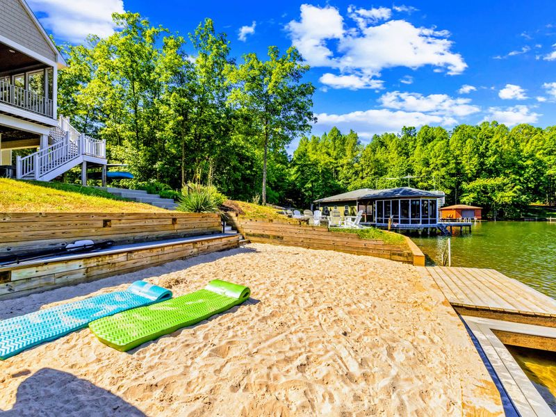 Sandy Beach - A private sandy stretch right at the water's edge, floats ready and the dock just a few steps away.