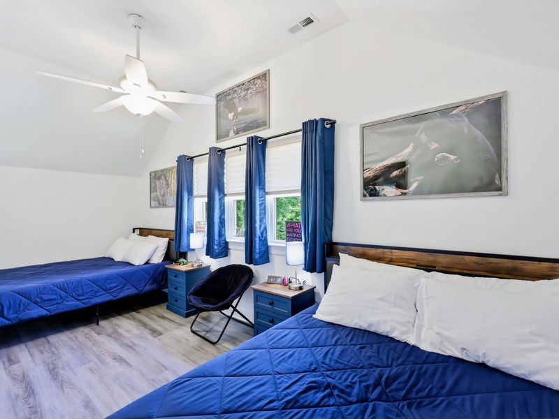 Bedroom - Two queen beds under a vaulted ceiling, ideal for kids, friends, or a shared room.