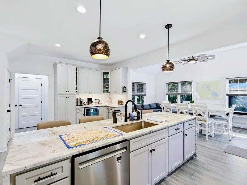 Kitchen - Open sightlines from the island to the great room so the cook never misses the conversation.
