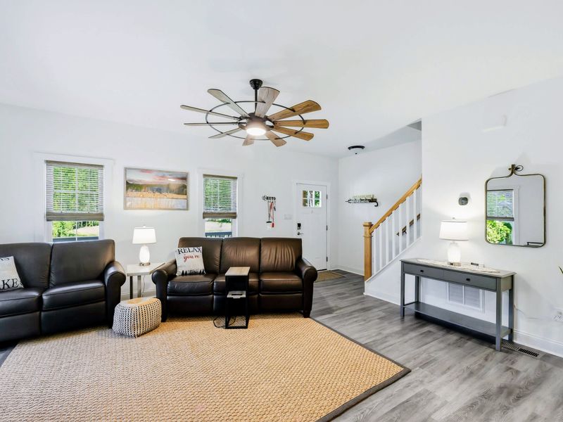Living Room - Comfortable seating opens to the stairs and kitchen, keeping everyone connected.