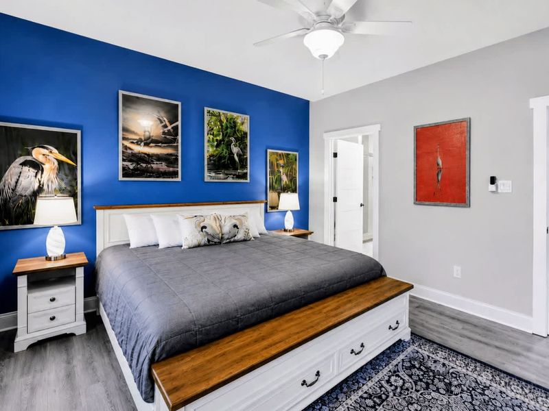 Primary Suite - Spacious main-level retreat with a king bed, gallery wall, and an ensuite just steps away.