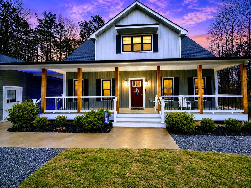 Front Porch - Rocking-chair porch wrapped in warm light, the perfect spot for morning coffee or an evening unwind.