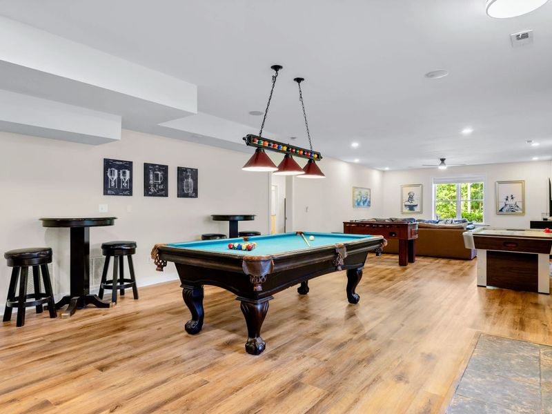 Game Room - Pool table ready for play, with foosball and air hockey waiting for the next challengers.