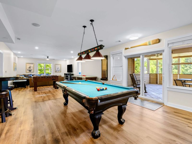 Game Room - Pool and foosball sit within steps of each other, with doors opening straight onto the covered porch.