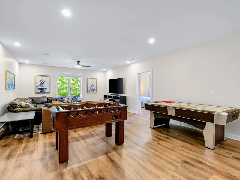 Game Room - Foosball and air hockey share the floor beside a comfy sectional and TV, rainy day plans solved.