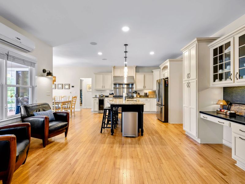 Great Room - Leather armchairs by the windows make a quiet sitting nook beside the open kitchen and coffee station.