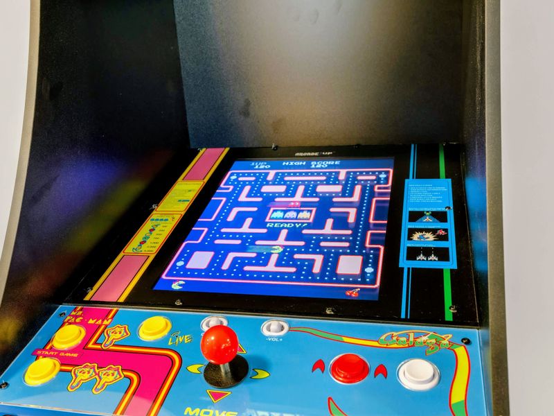 Game Room - The classic Ms. Pac-Man and Galaga arcade cabinet, joystick ready for anyone chasing the high score.