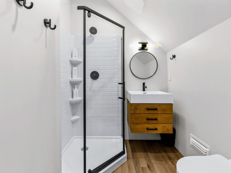 Library Suite - A walk-in shower and vanity finish the room's private bath.