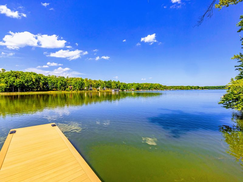 Dock - Calm cove water on Lake Anna's quiet public side, the still surface waiting for a morning paddle.