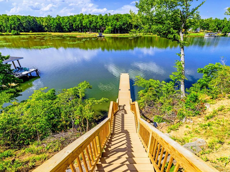 Dock - A long private dock reaches into the lake, your launch point for swimming and slow sunset cruises.