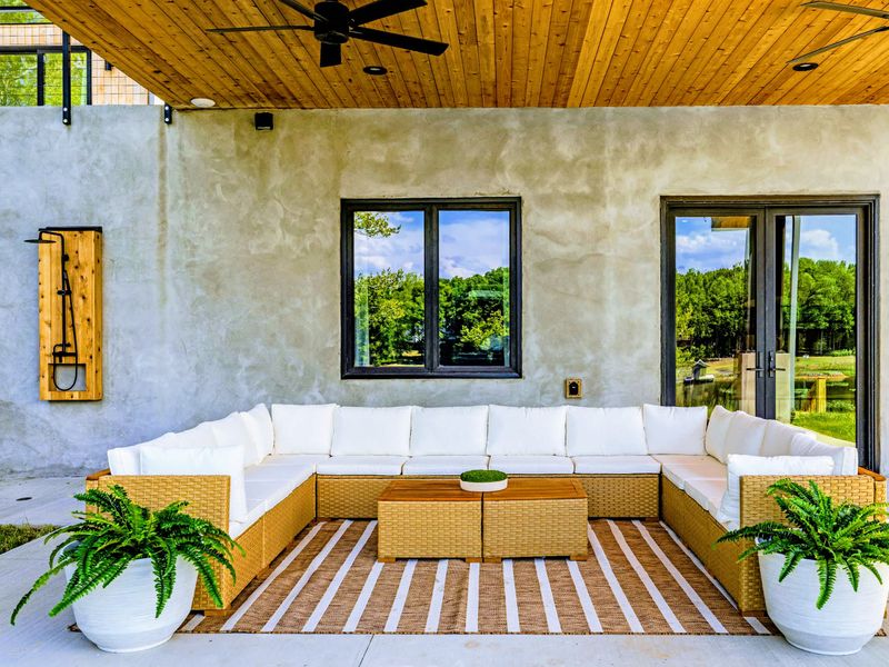Covered Patio - Built-in seating under cover, true to the home's Nordic design.