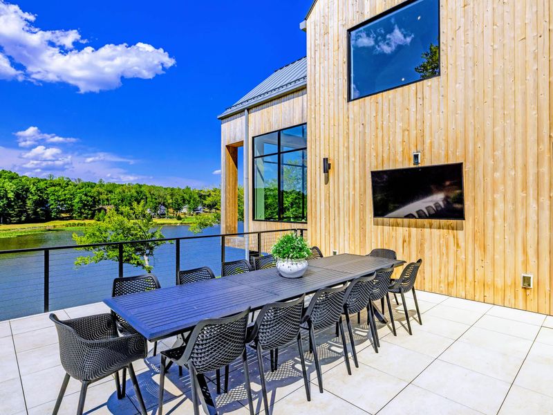 Outdoor Dining - A long table seats the whole crew under open sky.