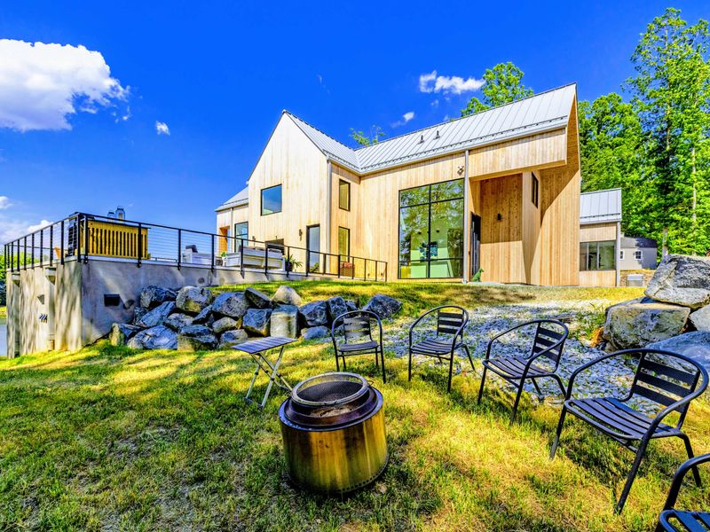 Fire Pit - Chairs circle the fire on the lawn between the house and the water, the easy end to a day on the lake.