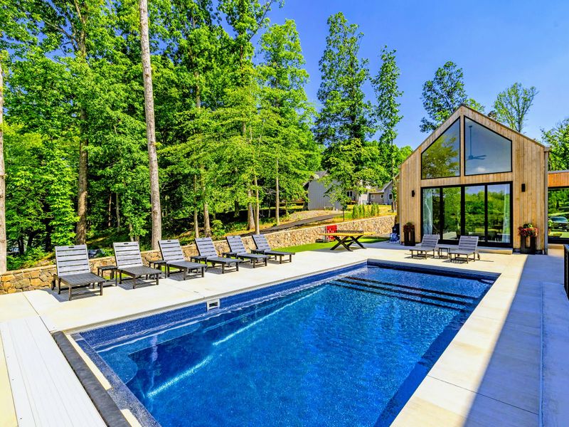Pool - Sun loungers line the water for full afternoons under an open sky.