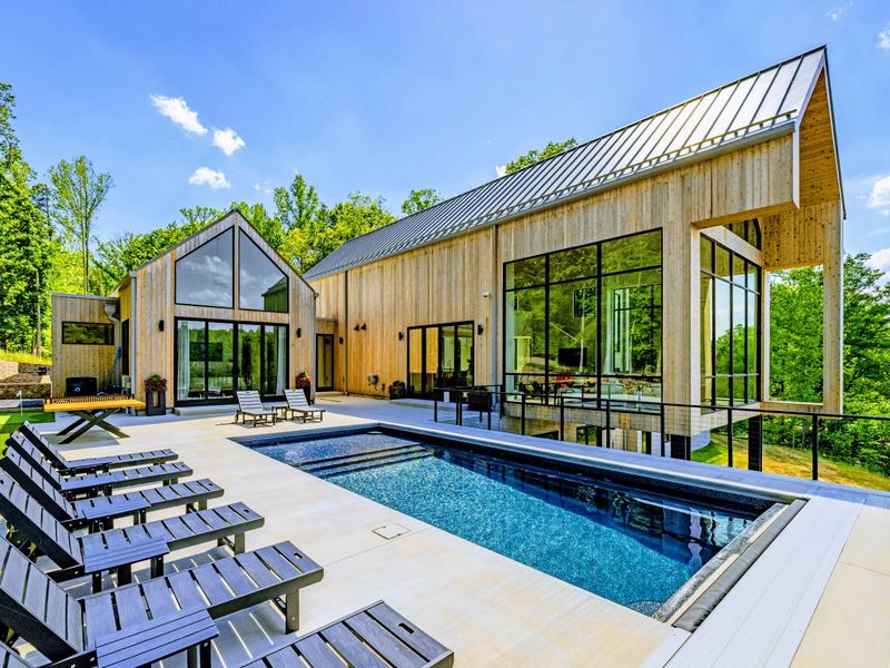 Pool - Framed by evergreens, the pool deck has space for the whole group.